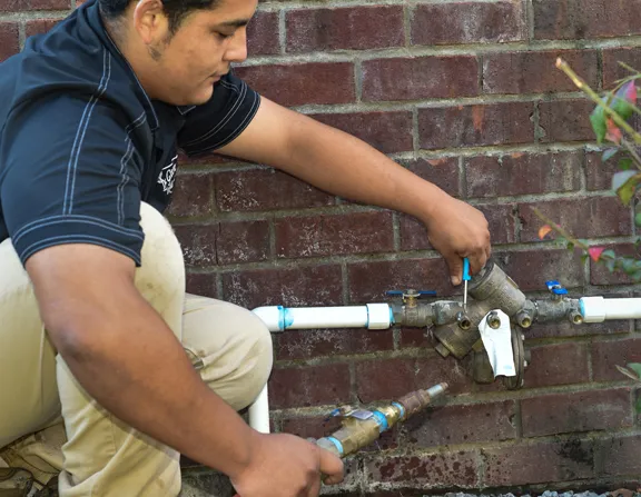 Blowing out a backflow assembly at winterization