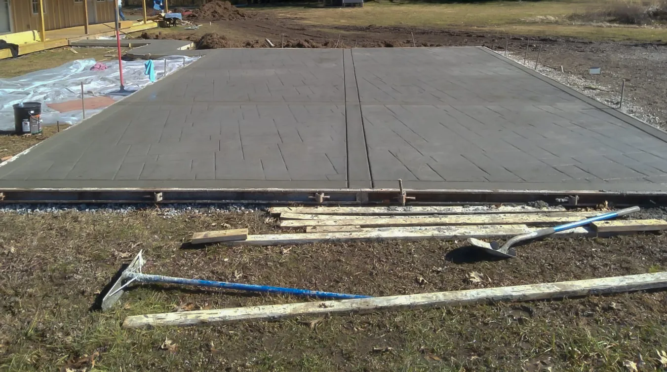 A concrete driveway being poured