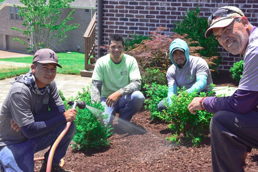 A Green Scene crew planting a new bed