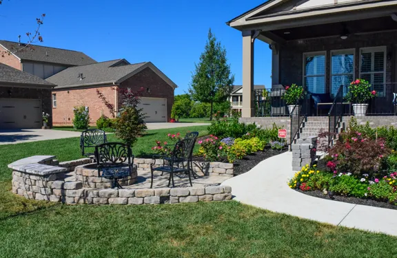 A paver patio behind a brick home