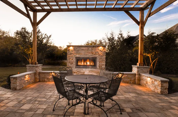 A dining set on a patio under a pergola