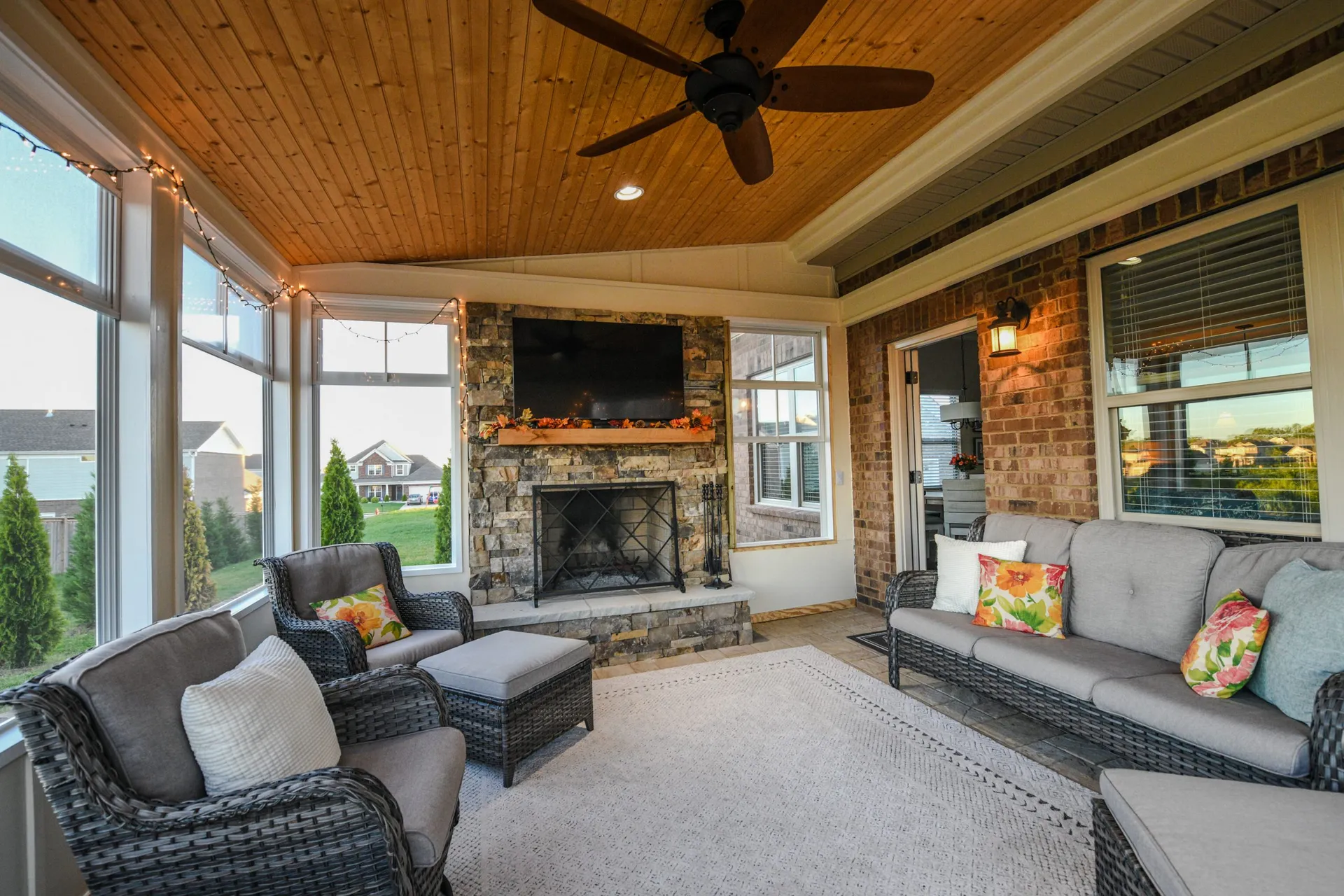 A screened porch furnished as a living room