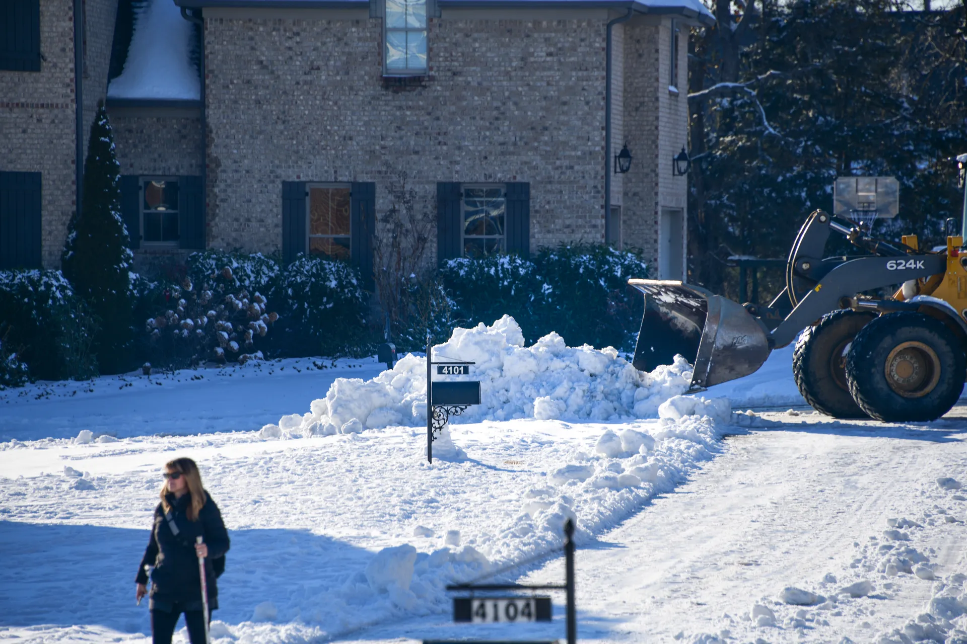 Shoveling a front walk after snow